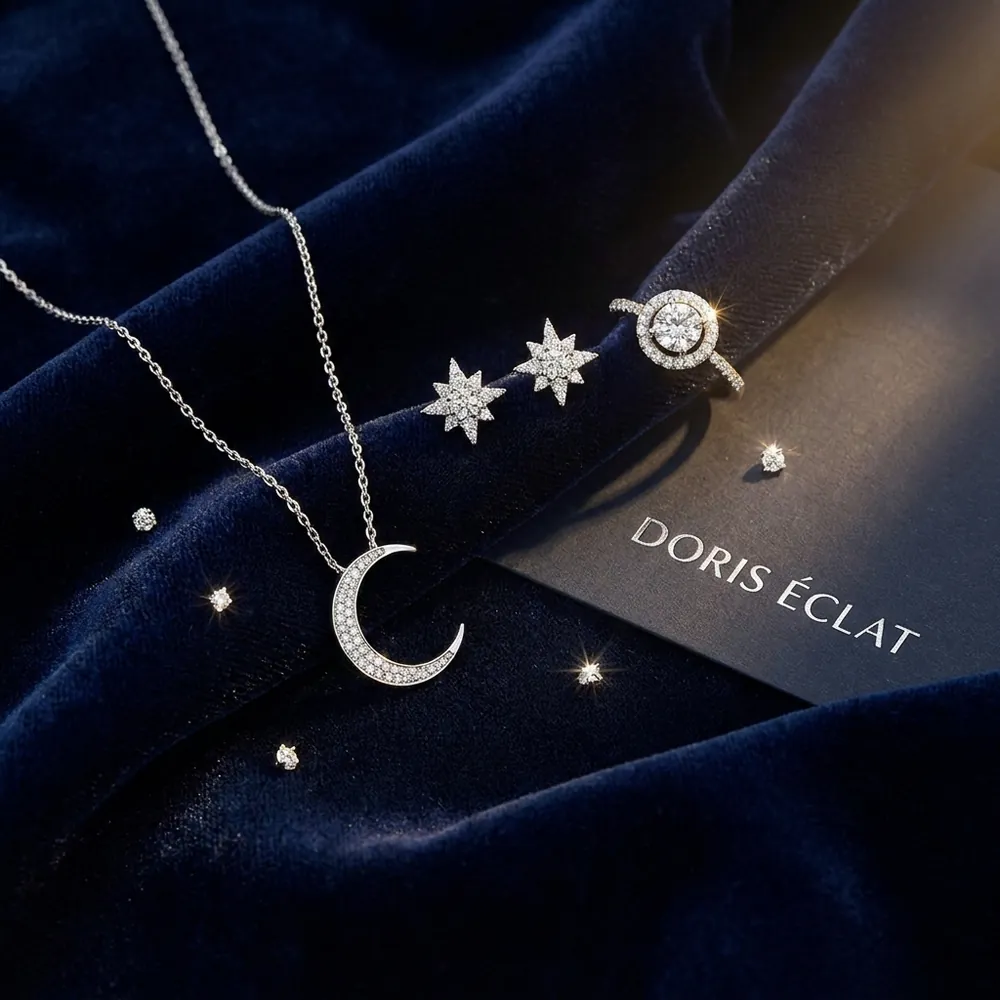 Moon and star jewelry on navy velvet