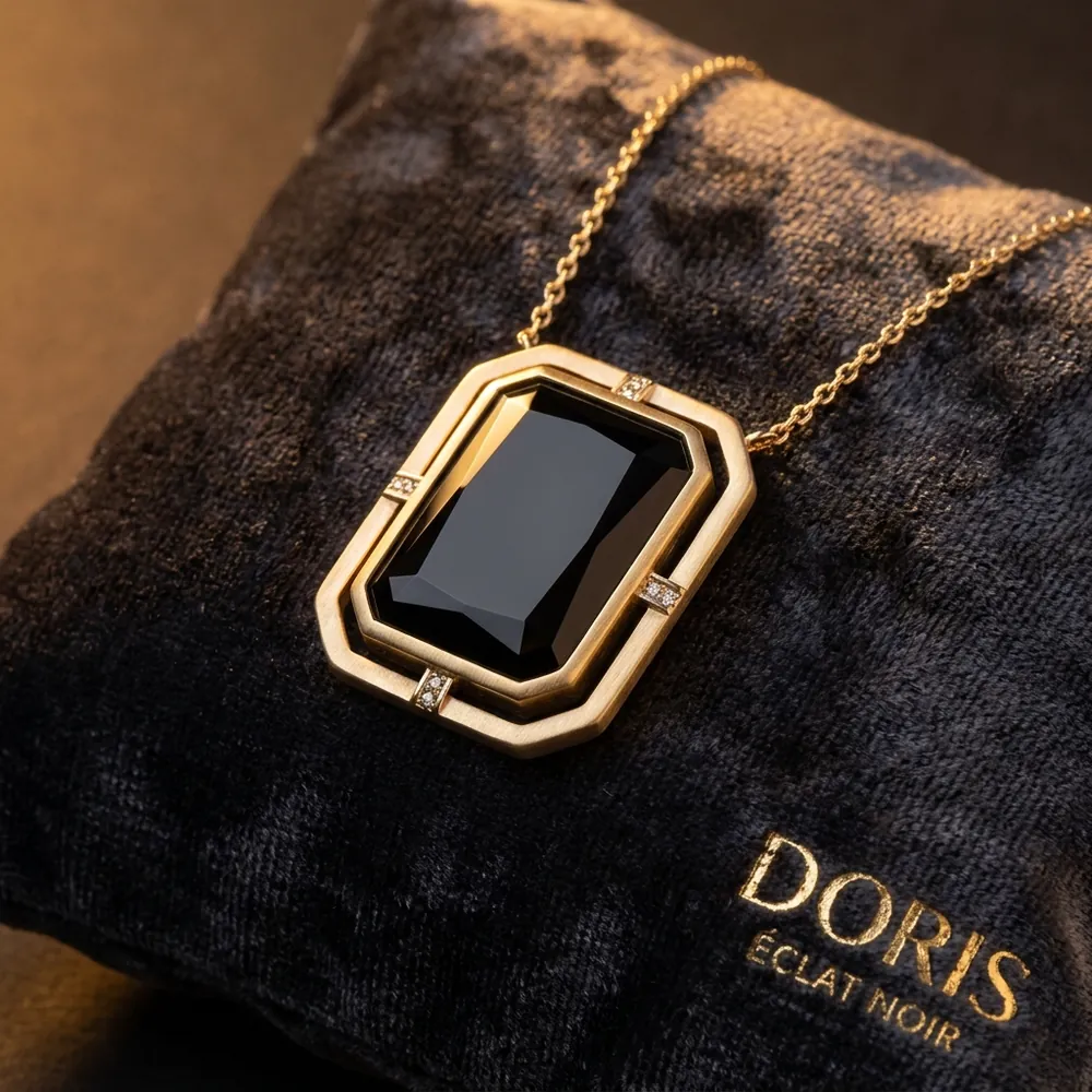 Black onyx pendant in gold on black velvet